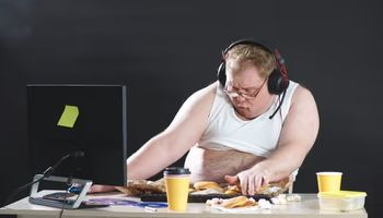 lazy plump man t shirt headphones wanders web people like computer games concept addiction 186451 473